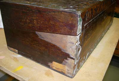 Unrestored front left corner of box