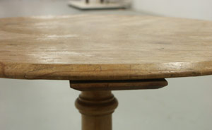 Table cupping (lifting at the edges)
